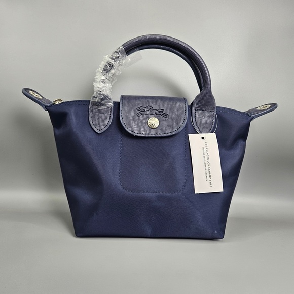 Longchamp Black Leather Handbag with Chic Silver Hardware